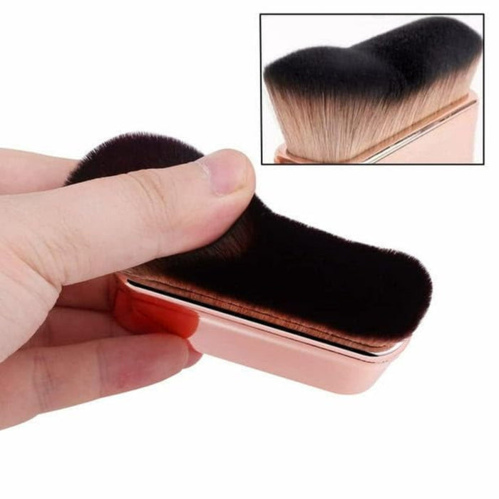 Compact gold makeup brush with gradient bristles shown from multiple angles