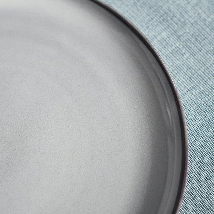 Close-up of IKEA GLADELIG 25 cm plate with smooth matte surface