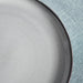 Close-up of IKEA GLADELIG 25 cm plate with smooth matte surface