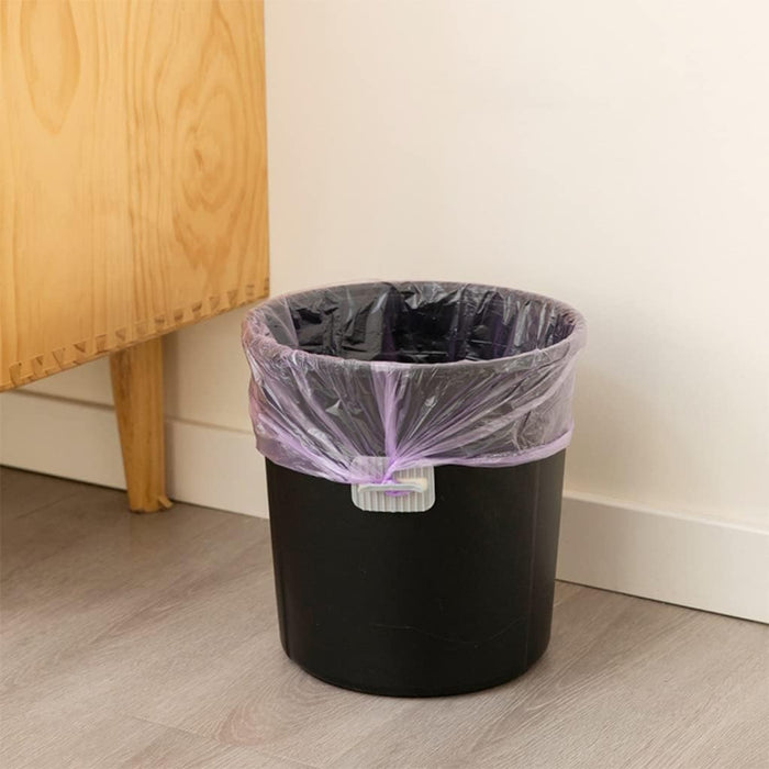 Digital Shoppy 4 Anti-slip Fixers For Household Garbage Bags, white clip securing purple liner on black trash bin in home setting
