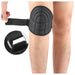 Black knee pad being worn on a person's knee with close-up inset showing the strap mechanism.