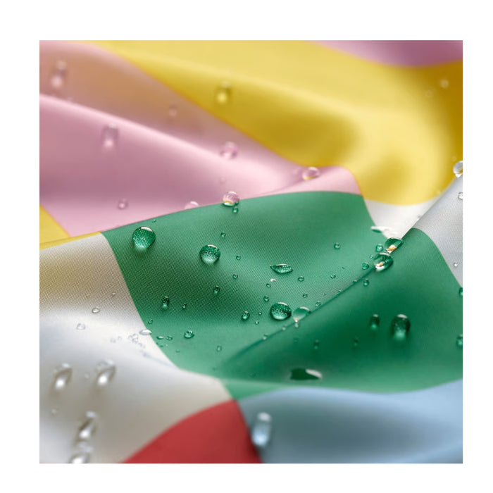 Colorful fabric with water droplets on a white background