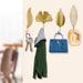 Gold leaf hook – mounted on dark wall holding keychain for stylish entryway storage
