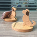 Digital Shoppy Wooden Phone Bracket, two cartoon puppy stands holding smartphones on wooden desk