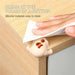 Soft silicone corner protector shaped like a cartoon puppy, attached to a wooden surface. Easy to clean and ideal for childproofing furniture edges. Pack of 4.-
