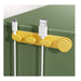 Yellow cable organizer holding USB and charging cables on a green surface