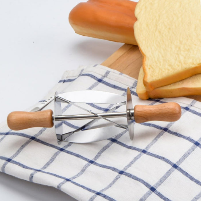 Dual-handled dough cutter with curved metal blades shown beside fresh bread – perfect for mixing and shaping pastry dough – 553248 13955755