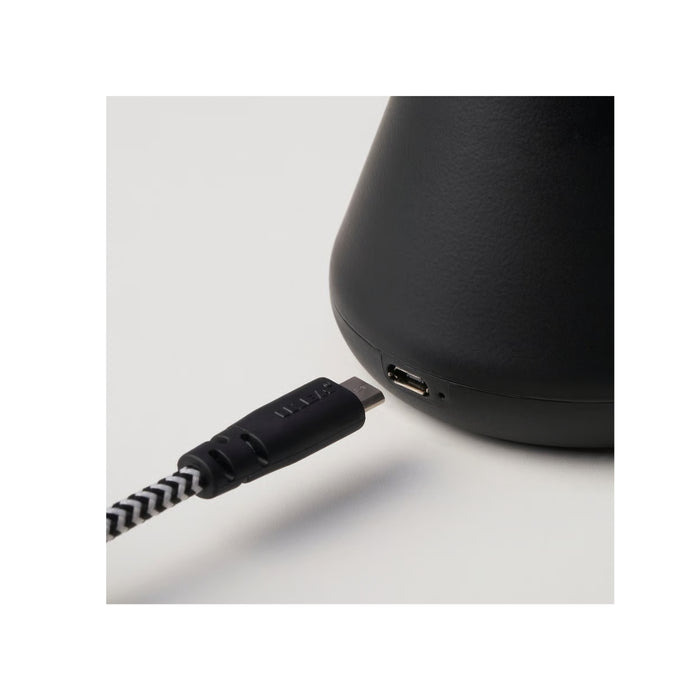 Close-up of IKEA BJÖRKSPIREA black LED light base showing USB-C charging port
