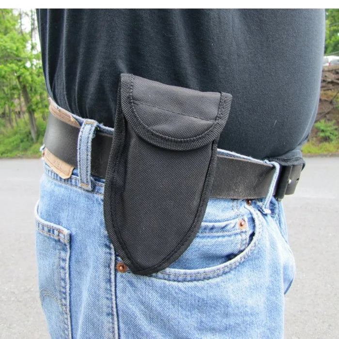 Stainless steel garden shovel – pouch attached to belt worn outdoors for easy access during gardening