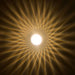 Light bulb with radiating yellow lines on a dark background