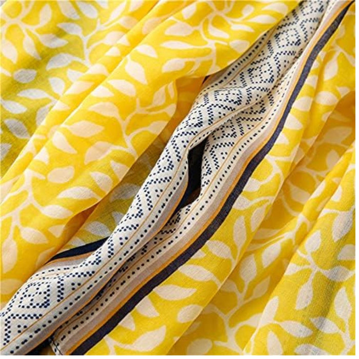 Digital Shoppy shawl scarf – close-up of yellow leaf print fabric with black-white border and mustard accent lines