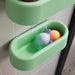 HUMLESJÖN basket used to organize bath toys and hygiene items in a playful, pastel-themed bathroom.

