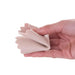 Hand wearing a pink glove holding a folded beige fabric strip on a white background