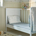 Dark yellow and blue fitted sheet on cot – IKEA GULDVÄVARE