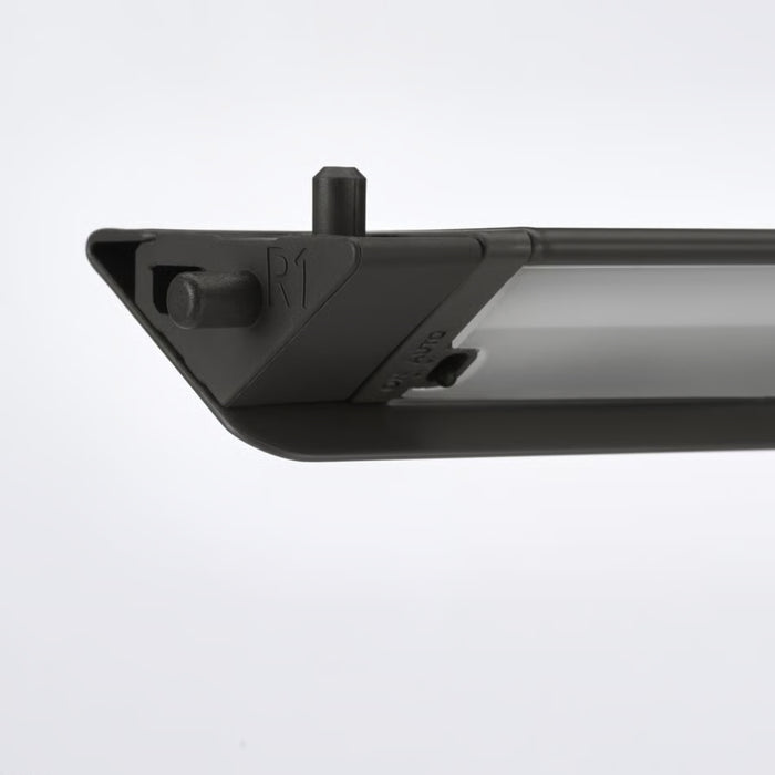 Close-up of a black metal bracket on a white background