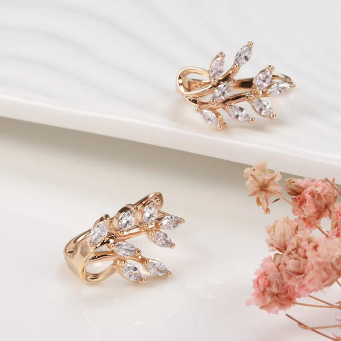 Rose gold wheat rings – matching leaf motif rings with zircon stones on ceramic tray