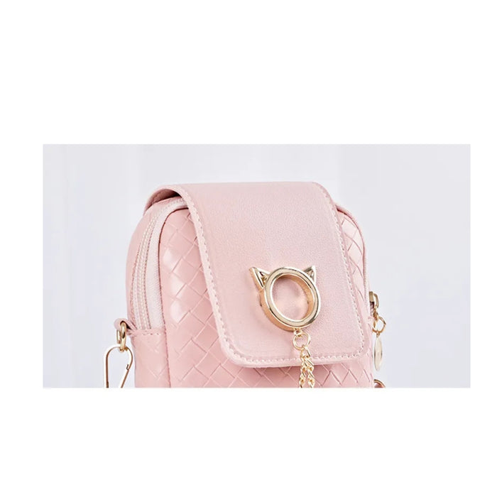 Pink quilted handbag with gold accents on a light gray background