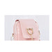 Pink quilted handbag with gold accents on a light gray background