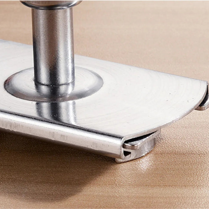 Metallic furniture leg on a beige surface