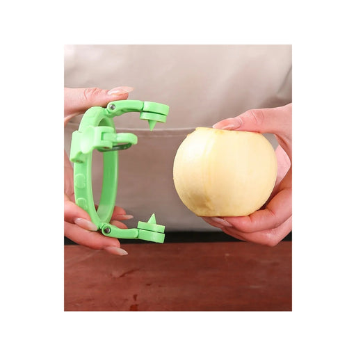 Green apple peeler being used on a yellow apple with a beige background