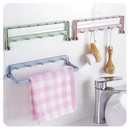 Versatile pink kitchen hanger that mounts on walls or stands freely to dry cloths and aprons