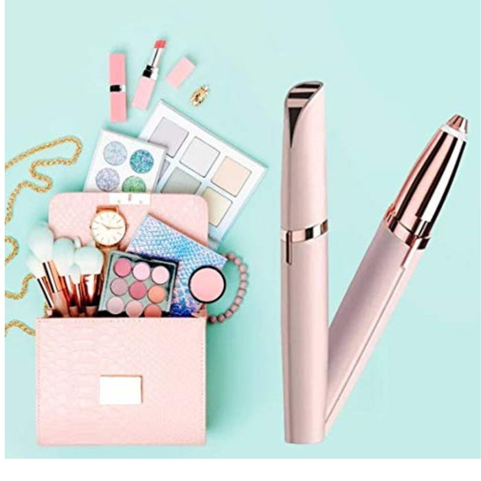 Beauty flatlay featuring rose pink eyebrow trimmers, makeup brushes, palettes, and accessories in a coordinated setup