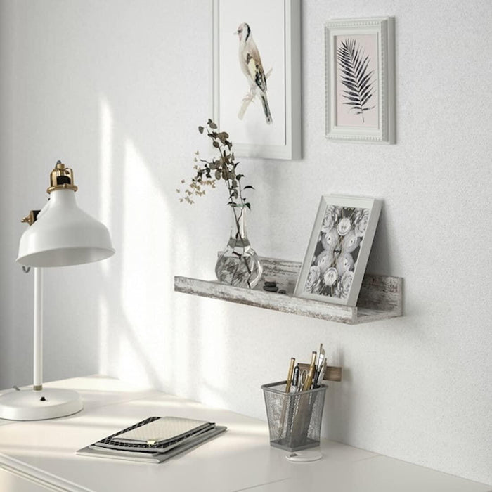 Minimalist IKEA MOSSLANDA white stained pine ledge with photo frames and small plants  80497812