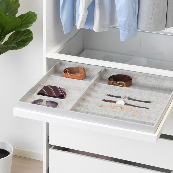 KOMPLEMENT insert placed inside wardrobe drawer, organizing belts, sunglasses, and striped necktie on left, watches on right