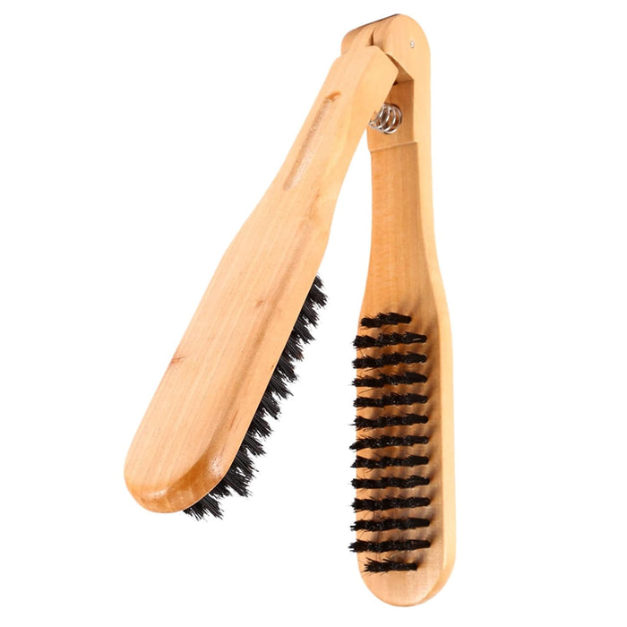 Wooden shoe brush with black bristles on a white background