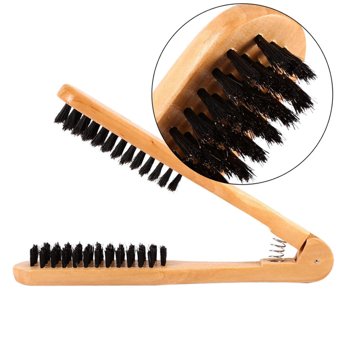 Wooden brush with black bristles on a white background