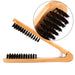Wooden brush with black bristles on a white background