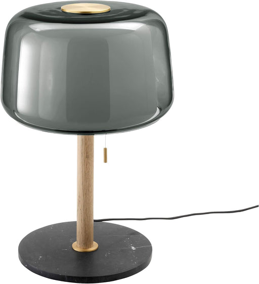 Table lamp with smoked glass shade, wooden base, and black marble base on a white background
