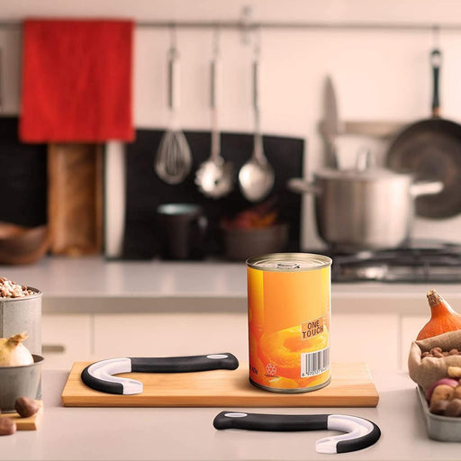 Can of food on a kitchen counter with cooking utensils in the background