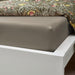 IKEA ULLVIDE grey-beige fitted sheet on white bed frame close-up breathable percale fabric