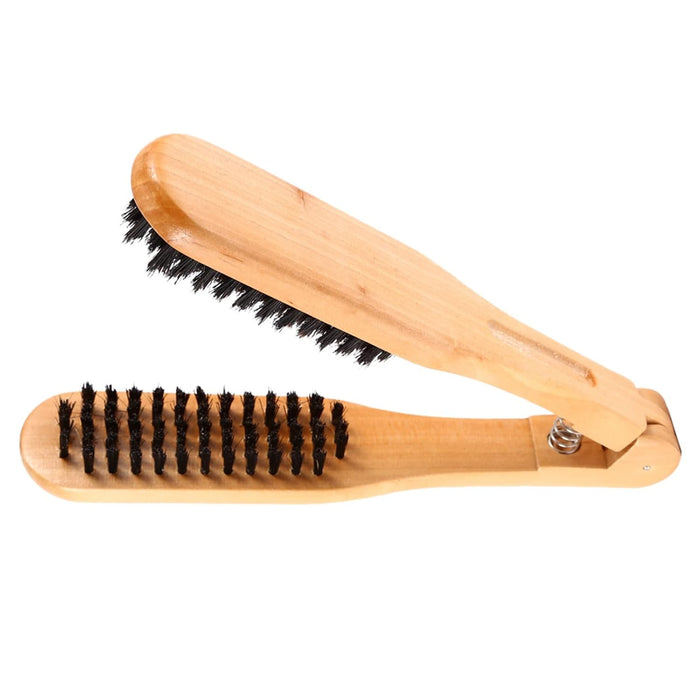 Wooden shoe brush with black bristles on a white background