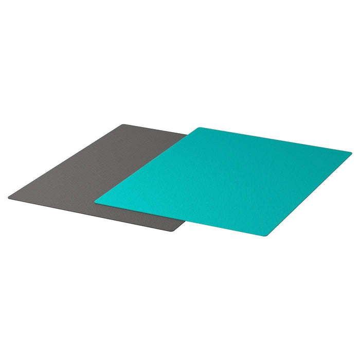 Two rectangular mats, one gray and one turquoise, on a white background