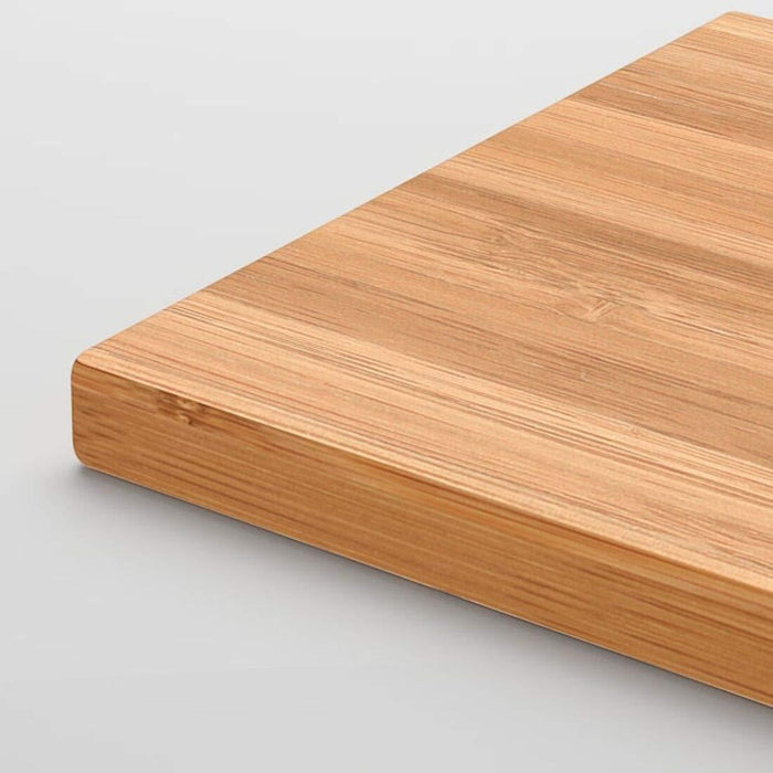 Wooden cutting board on a light gray background