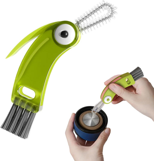 Green cleaning brush with a handle shaped like a fish, being used to clean a container.