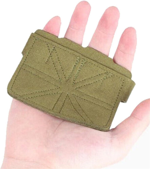 Green wrist support brace on a hand against a white background