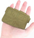 Green wrist support brace on a hand against a white background