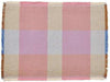Multicolored checkered fabric with pastel shades on a plain background
