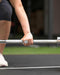 Person holding a barbell on a track