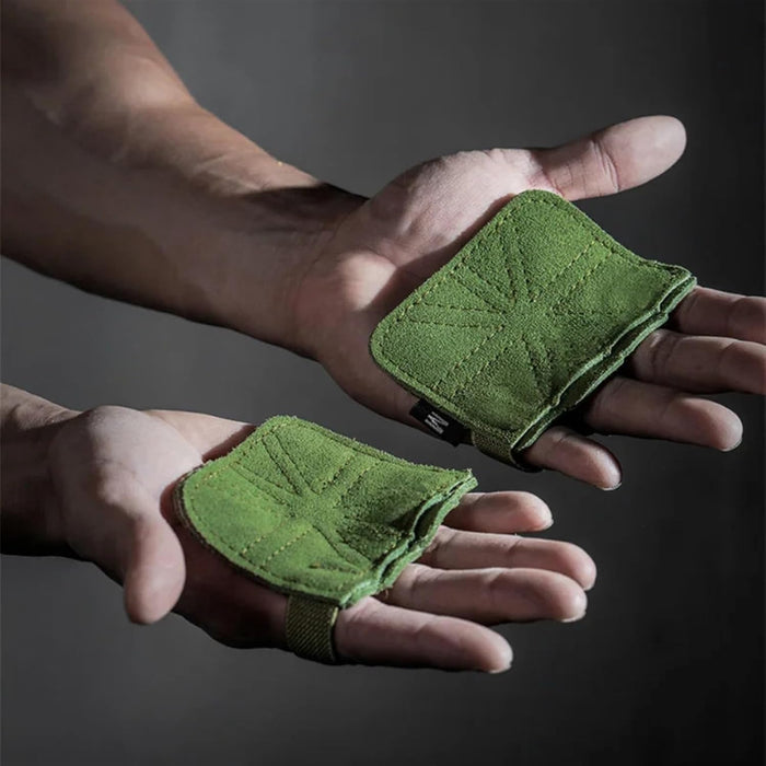 Green wrist wraps on hands against a dark background