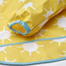 Close-up of IKEA KLADDIG bib in yellow/white; features cheerful sunburst pattern with white circular suns and radiating lines on yellow fabric – accented with blue trim and elastic cuff for secure fit during toddler mealtime or play - 00607145