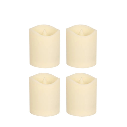 Four white candles on a white background
