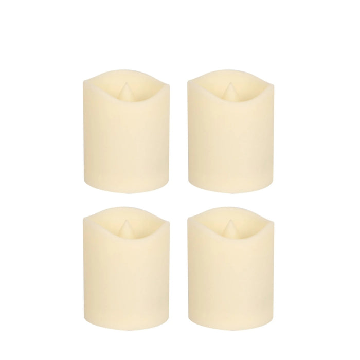 Four white candles on a white background