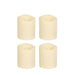 Four white candles on a white background