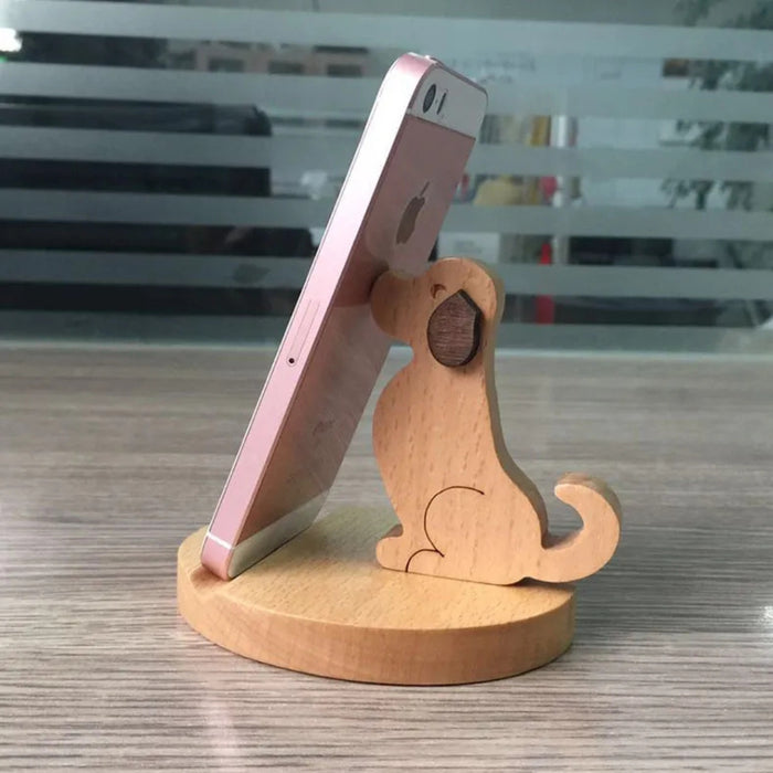 Digital Shoppy Wooden Phone Bracket, dog-shaped stand holding pink phone upright on circular base