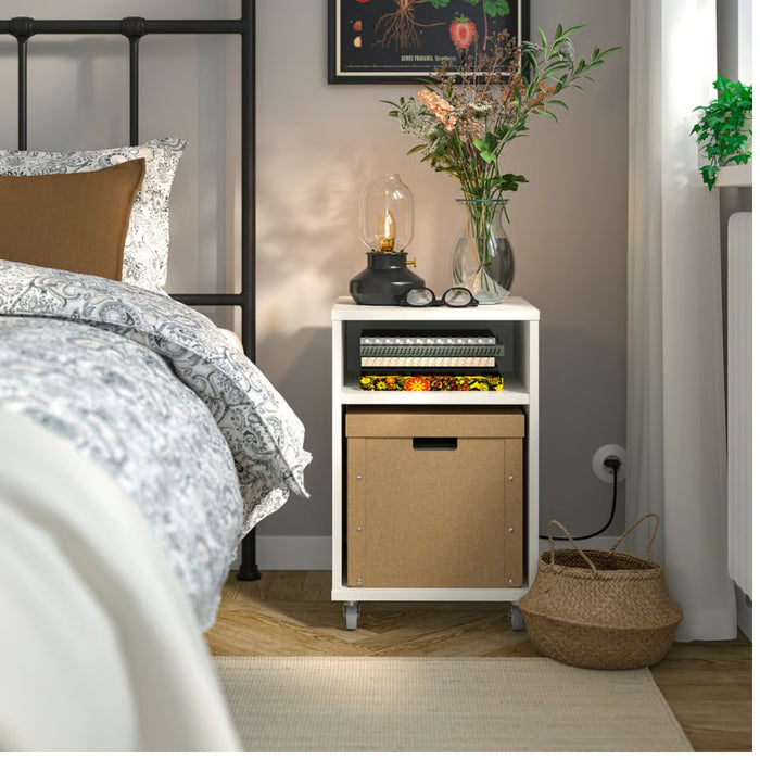 IKEA GÄRDESGÅRD storage box – cozy bedroom corner with white nightstand, floral vase, and brown box below shelf-30596956