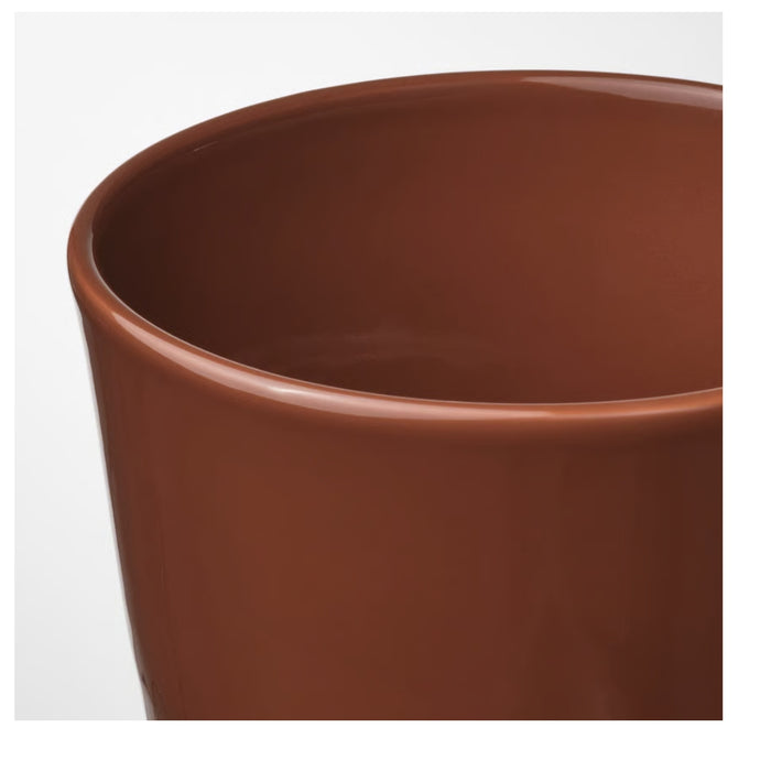 “Glossy cylindrical plant pot with drainage hole and saucer, 12 cm, in red-brown light beige colour.”

